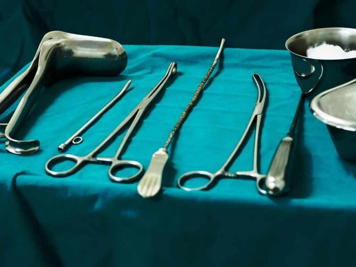 Surgical instruments arranged on a teal drape